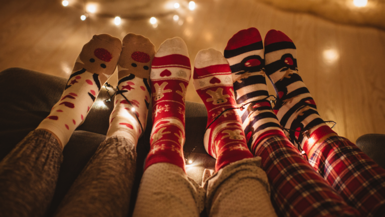 3 people in pjs and socks on a sofa